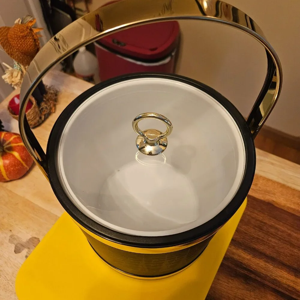 vintage ice bucket black with a sailboat design with a gold touch